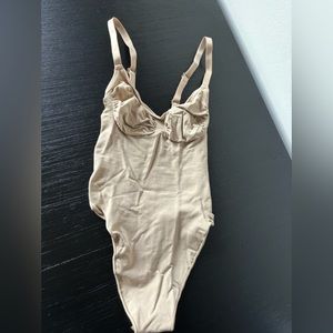 Skims Seamless Sculpt Thong Bodysuit in Clay